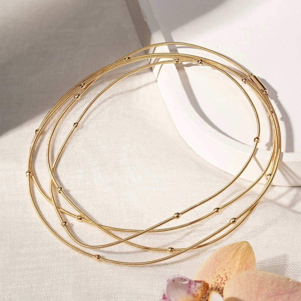 Pulseira corda de violão bolinhas